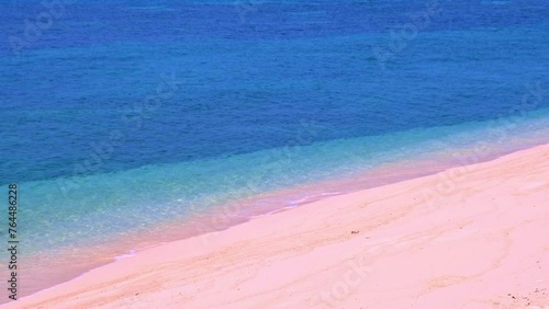  view of sandy beach for summer vacation concept. Nature of the beach and sea in summer with sunlight, and light sand. The sea sparkles against the blue sky. Sandy Beach for summer vacationconcept	 photo