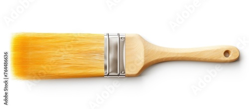 An image of a single paint brush featuring a wooden handle isolated on a simple white background photo