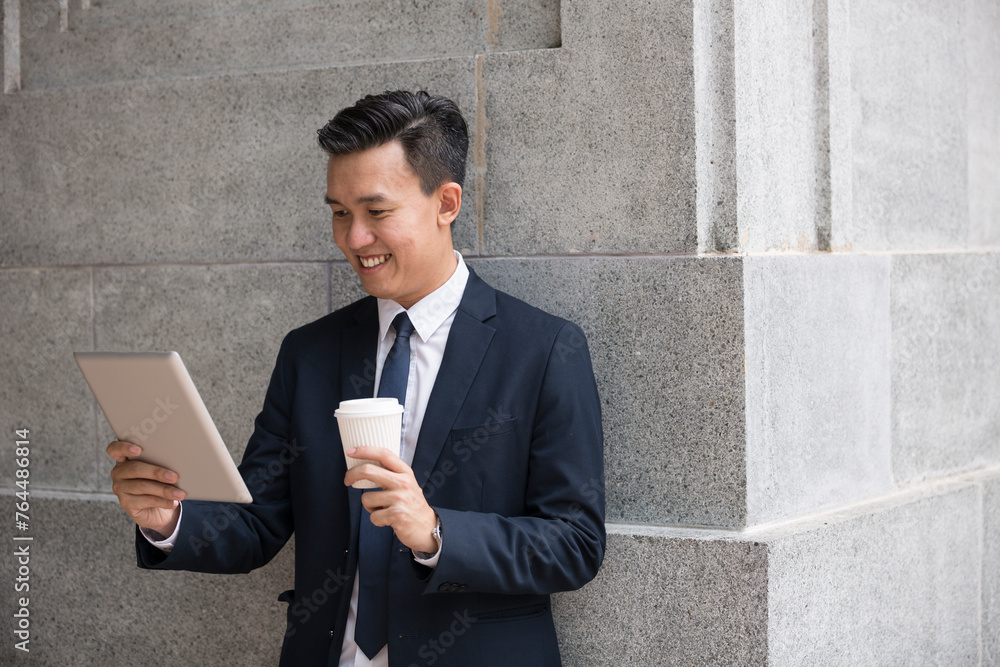 Asian business man using digital tablet computer. Asian business man using digital tablet computer.