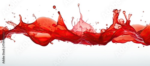An extreme close-up of a vibrant red liquid splashing onto a clean white surface