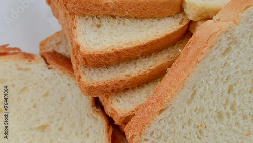 Close-up of fresh and appetizing sliced bread, perfect for a delicious breakfast. Fresh, fluffy, and irresistible sliced bread in a close-up that whets the appetite. photo