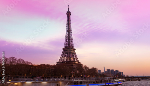 Banner of travel in Paris with Eiffel Tower iconic Paris landmark across the River Seine with  tourist boat in  Autumn tree fall scene at Paris ,France © SASITHORN