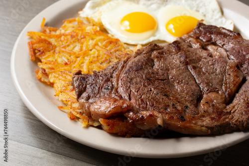 Obraz na plátně A view of a breakfast plate of steak and eggs.