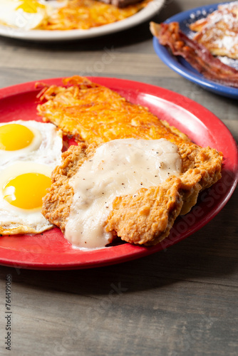 A view of a country fried steak breakfast plate.