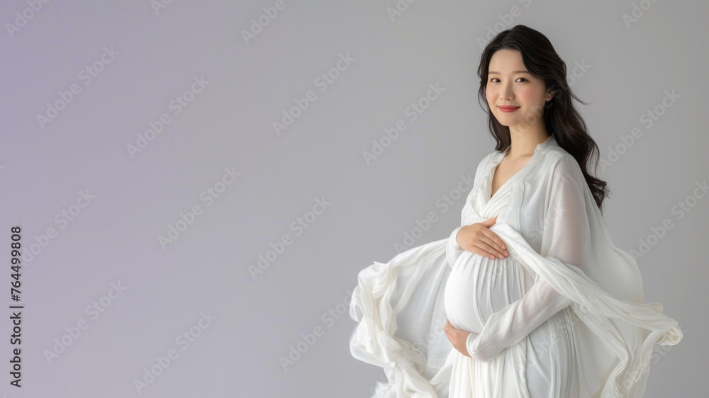 Asian pregnant woman with pregnancy belly, in soft white clothes Asian pregnant woman with pregnancy belly, in soft white clothes