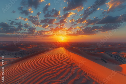 Sunset over the undulating sand dunes of a vast desert.