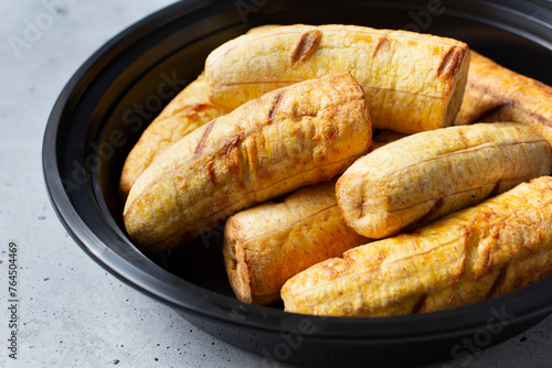 A view of a container of roasted plantains.