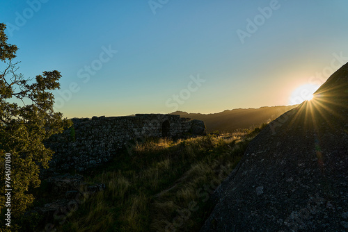 Medieval Castle Ruins of Castro Laboreiro high on a cliff in the mountains of northern Portugal inside Geras national park. photo