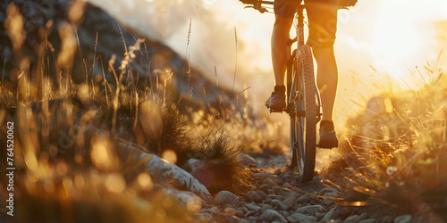    A downhill bike on the rocky street with forest background. Bright afternoon sunshine. Ground level viewpoint, Extreme mountain biking downhill on a hardtail bike  and sun set in the background   
 photo