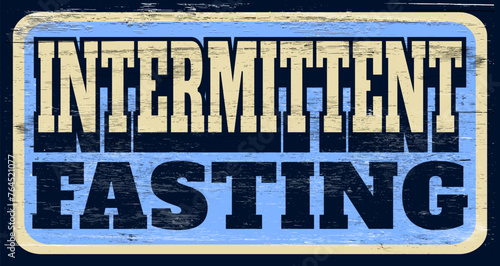 Grunge intermittent fasting sign on wood