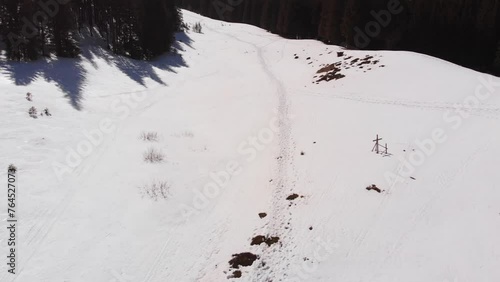 Trail through the snow into the high mountains. 