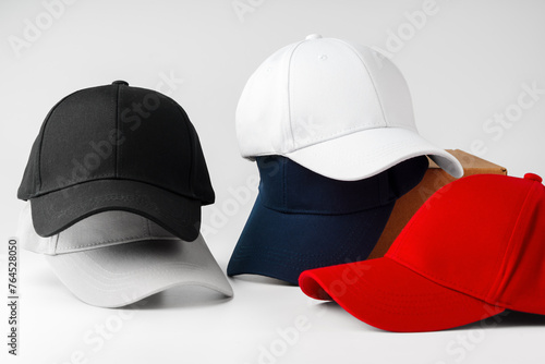 Photography Stack of Assorted Baseball Caps on a White Background