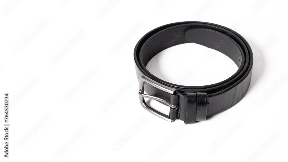Twisted black leather belt with matted metal buckle isolated on white background. Fastened fashionable unisex, man or woman accessory for trousers, jeans, dress. Male luxury strap. Haberdashery goods Twisted black leather belt with matted metal buckle isolated on white background. Fastened fashionable unisex, man or woman accessory for trousers, jeans, dress. Male luxury strap. Haberdashery goods
