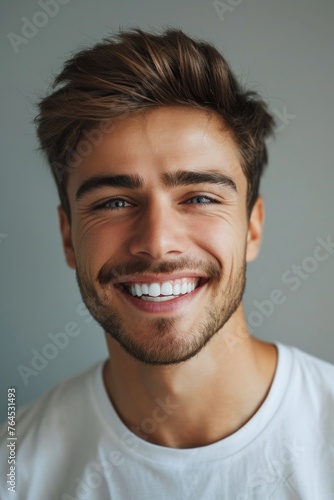 A man with a beard smiling at the camera. Suitable for business or lifestyle concepts