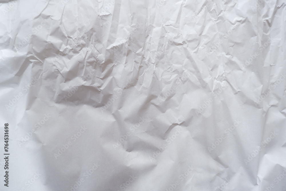 The texture of white paper is crumpled. Background for various purposes.crumpled white paper material The texture of white paper is crumpled. Background for various purposes.crumpled white paper material