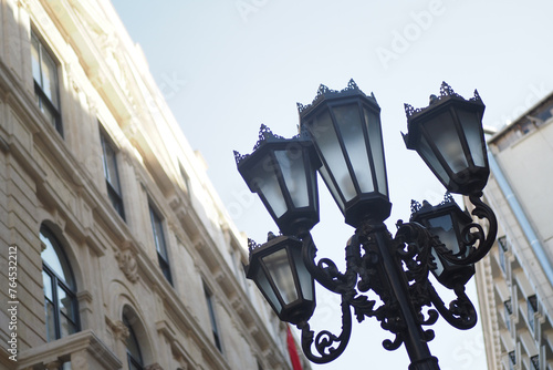Elegant street lamp surrounded by buildings 