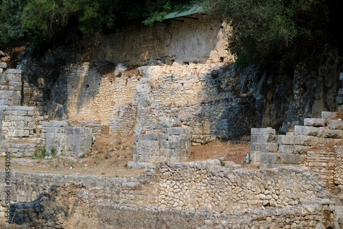 Ruins of the Great Basilica in Butrint National Park, Buthrotum, Albania. Triconch Palace at Butrint Life and death of an ancient Roman house Historical medieval Venetian Tower surrounded photo