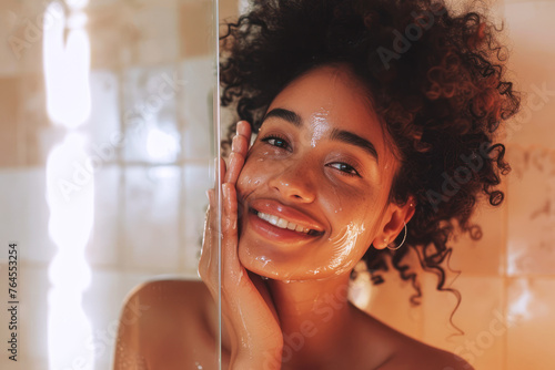 Afro woman wash her face with facial foam and water, beauty skin care