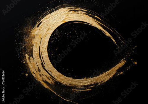 Abstract golden paint circle on a black background