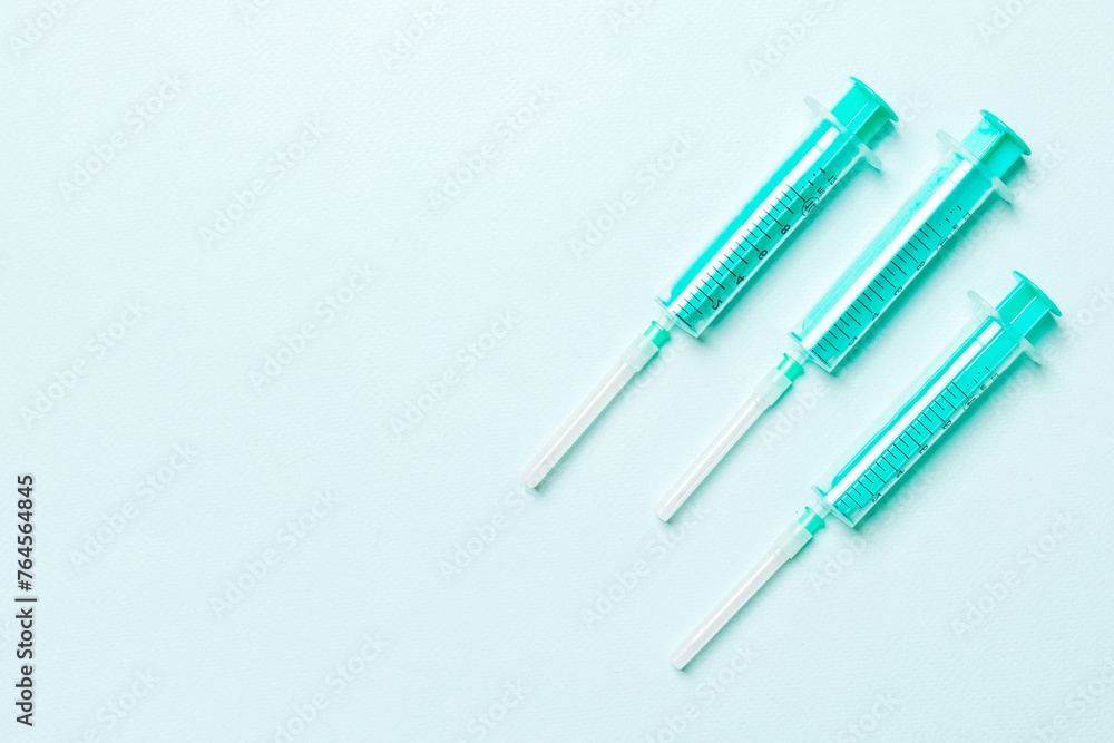 Top view of medical syringes on colorful background. Health care concept with copy space Top view of medical syringes on colorful background. Health care concept with copy space