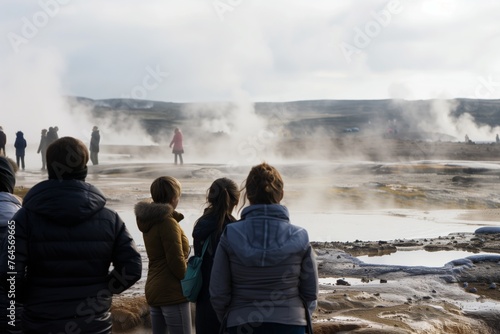 visitors watching geothermal springs without touching