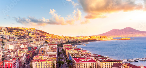 Fototapeta Naklejka Na Ścianę i Meble -  beautiful panorama of Naples city with amazing coast, sea port, streets and buildings and volcano Vesuvius with anazing sky on background