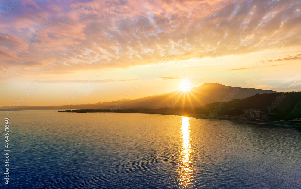 picturesque view to a sunset sea gulf with beautiful mountains and amazing cloudy sky on background of nice travel landscape