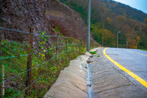 Detailed asphalt road profile: A closeup view showcasing the texture and surface intricacies of the road, inviting exploration of its unique characteristics photo