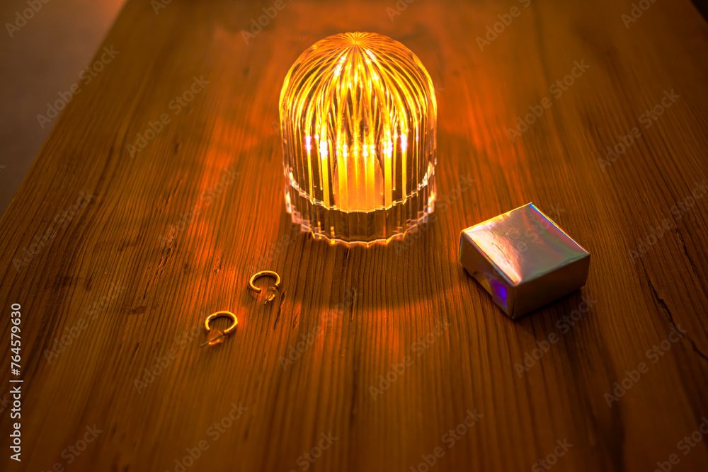 Elegant Unveiling: Earrings, Gift Box, and Table Light