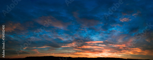 Cloudy sky panorama during sunset photo