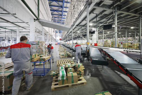 three man - People work in warehouse and sorting center of internet shop,