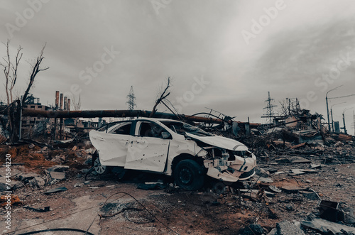 burnt cars and destroyed buildings of the workshop of the Azovstal plant in Mariupol photo