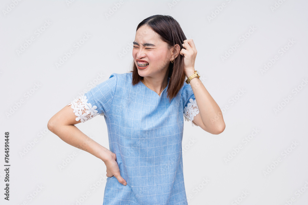Frustrated Asian woman scratching her head in confusion, isolated on white Frustrated Asian woman scratching her head in confusion, isolated on white