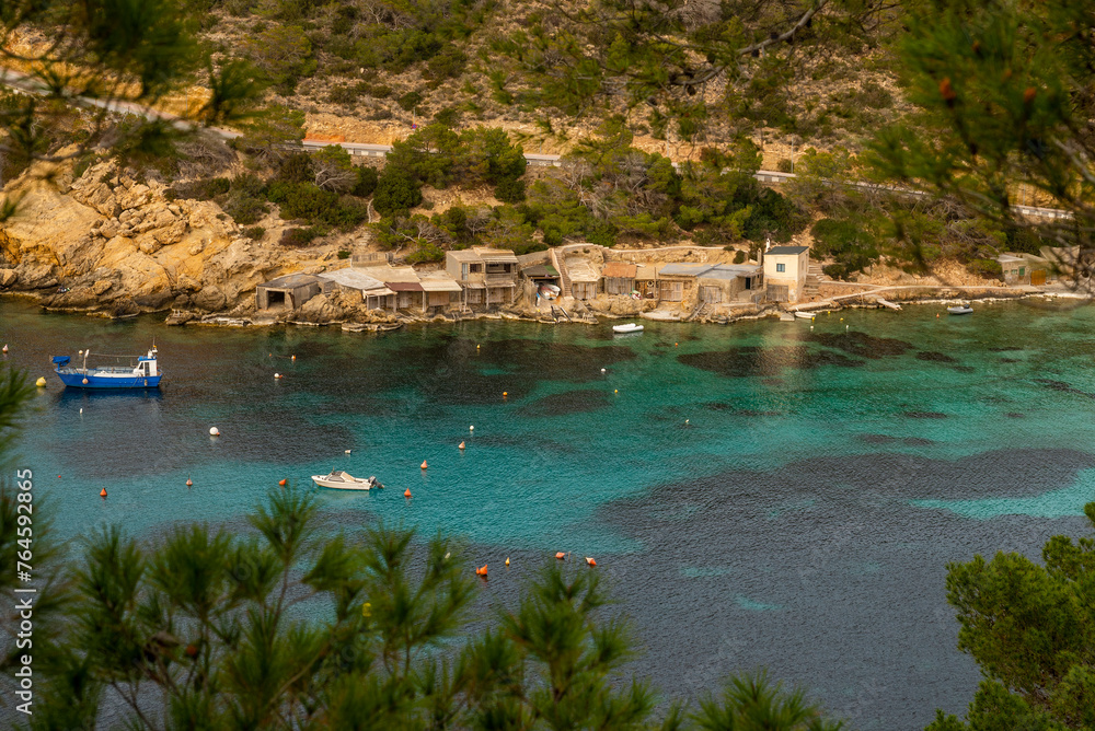 Fishermen old huts on the coastline of Cala Vedella beach, Sant Josep de Sa Talaia, Ibiza, Balearic Islands, Spain
