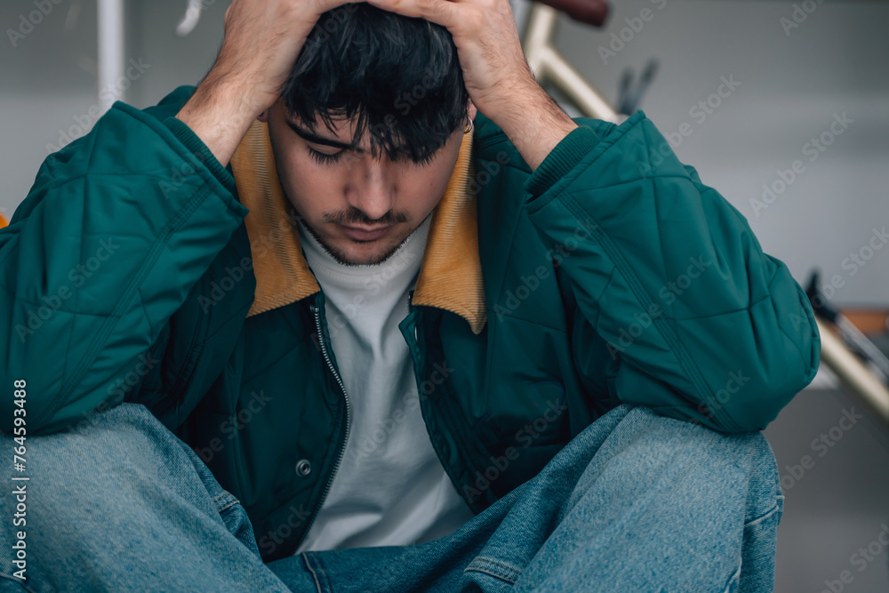 young man at home distressed or depressed