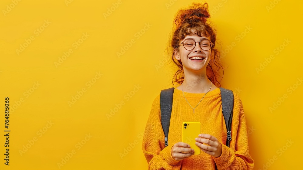 Smiling teen girl with a phone on background with copyspace for your text Smiling teen girl with a phone on background with copyspace for your text