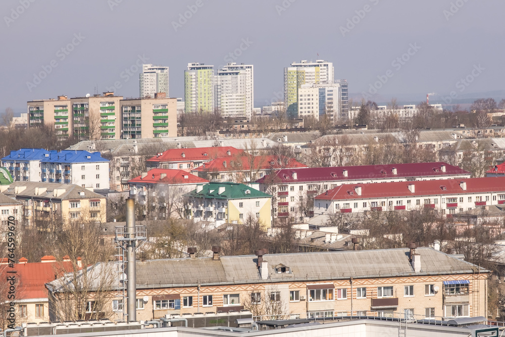 Naklejka premium aerial panoramic view from great height of city with a private sector and high-rise urban apartment skyscraper buildings