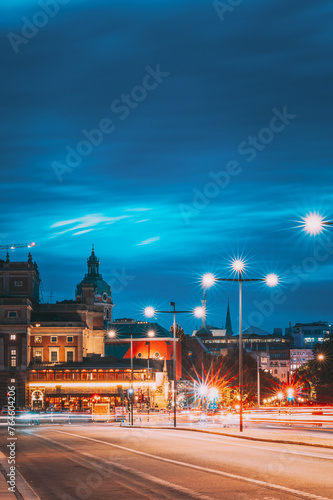 Stockholm, Sweden. Scenic View Of City Center In Sunset Twilight Dusk Lights. Evening Lighting. Skeppsbron Street. photo