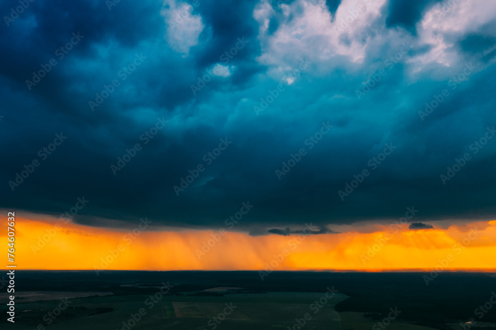 Aerial View. Sunset Sky Above Green Forest, Meadow And Fields Landscape In Sunny Evening. Top View Of European Nature From High Attitude In Summer Sunrise. Bird's Eye View. Belarus.