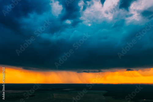 Aerial View. Sunset Sky Above Green Forest, Meadow And Fields Landscape In Sunny Evening. Top View Of European Nature From High Attitude In Summer Sunrise. Bird's Eye View. Belarus. © Grigory Bruev