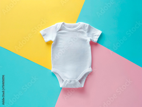 White baby onesie on pastel tricolor background, simple, clean, infant fashion.