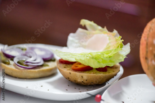 Preparation steps of homemade hamburger with fresh vegetables, spices, cheese and meat