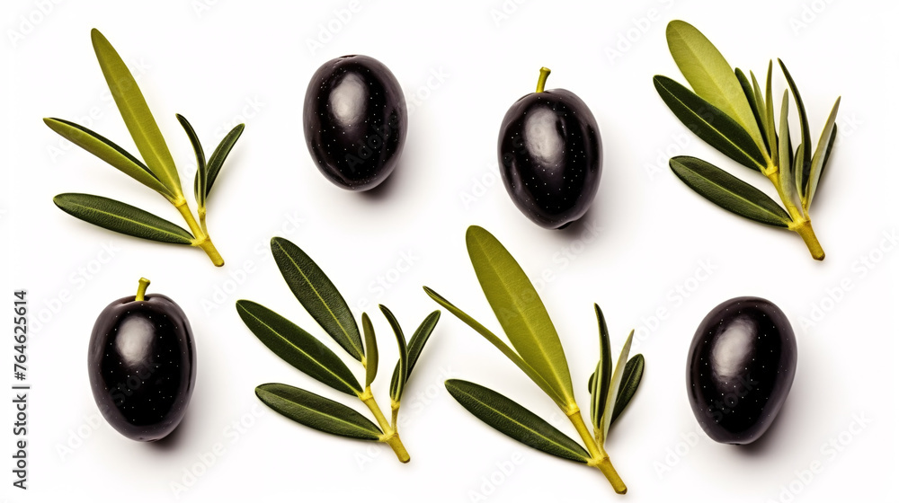 Black olives with leaves isolated on white background. Top view. Flat lay pattern. Black olives with leaves isolated on white background. Top view. Flat lay pattern.