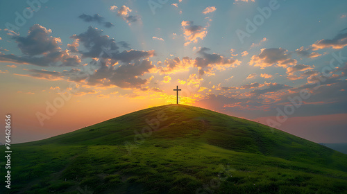 Cristian cross on top of a green hill at sunset. It depicts a serene and peaceful religious symbol in a natural landscape.
