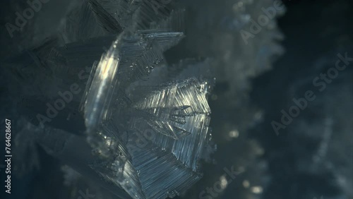 Close up ice crystal, sharp ice snowflakes on stalactites inside cave  photo