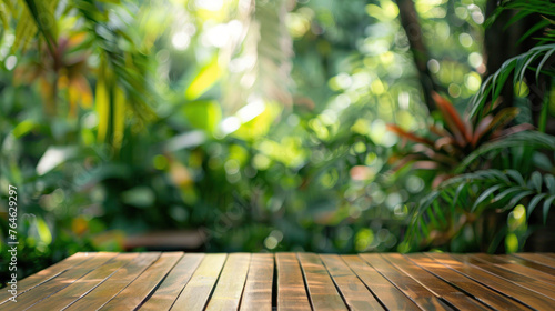 Refreshing tropical garden with bright sunlight filtering onto a glossy wooden surface