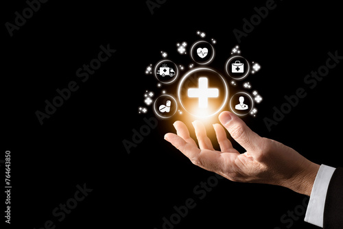 Hand showiing the first aid sign , healthcare and hospital,Medical ,icon medical connection with modern virtual screen interface, medical technology concept. photo