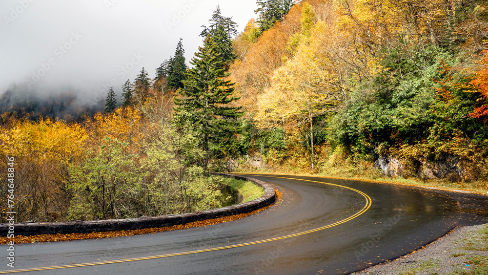 Naklejka premium road to the mountains uphill to the clouds