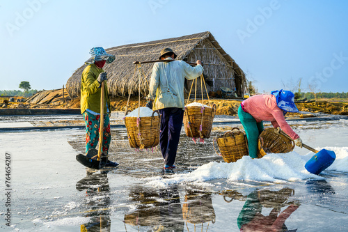 Farmers are harvesting salt in Can Gio district, a suburban district of Ho Chi Minh City, Vietnam.