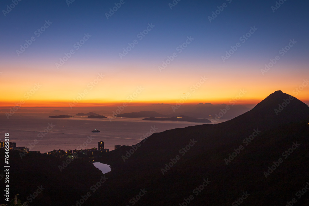 Golden Horizon: A Glimpse of Sunset from Victoria Peak, Hong Kong Golden Horizon: A Glimpse of Sunset from Victoria Peak, Hong Kong